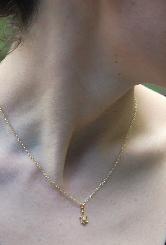 NK TURTLE GOLD ON MODEL